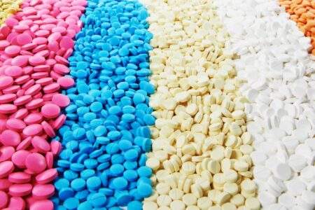 Tablet coating process control with inline viscosity and density measurements